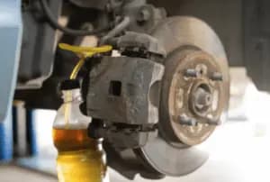 Brake fluid pouring into a bottle